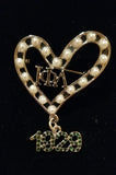 A 💚 for Iota Phi Lambda pin