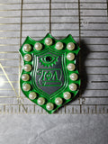 Pearl and emerald emblem pin